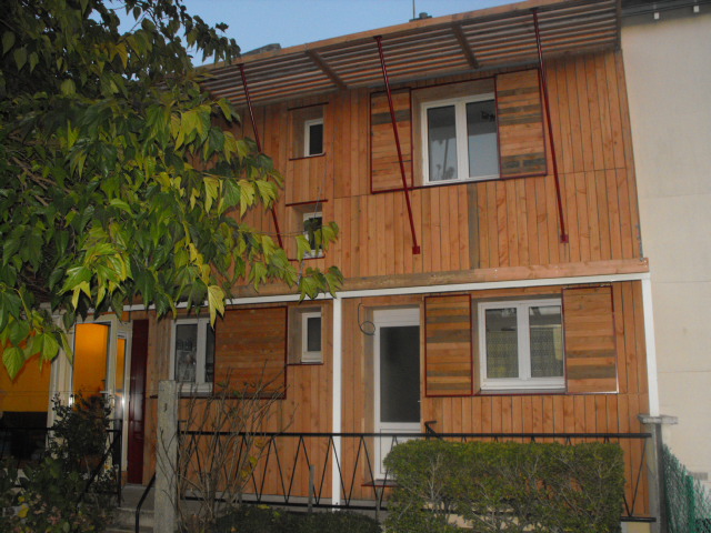 Isolation ext et reprise de façade avec volets coulissants