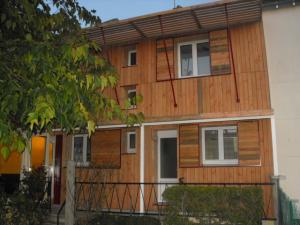 Isolation ext et reprise de façade avec volets coulissants